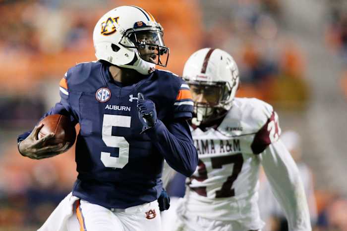 Nov 19, 2016; Auburn, AL, USA; Auburn Tigers quarterback John Franklin (5) scores a touchdown during the third quarter against the Alabama A&M Bulldogs at Jordan Hare Stadium. Mandatory Credit: John Reed-USA TODAY Sports
